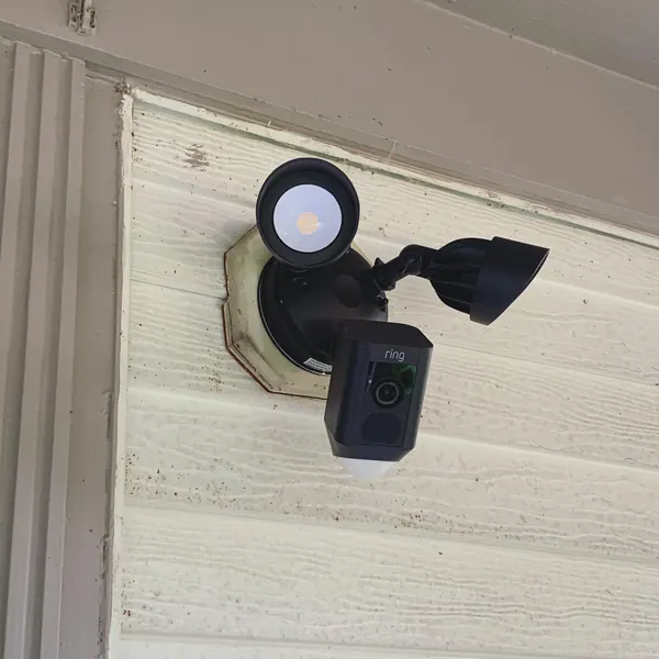 Before and after: outdoor light replaced with Ring floodlight camera (after: Ring floodlight camera installed)