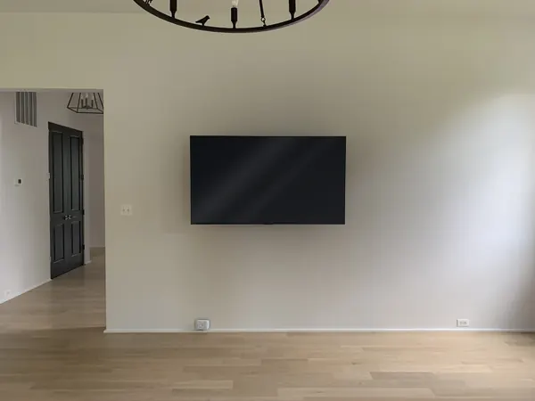 Flush TV wall mount with concealed wires in living room