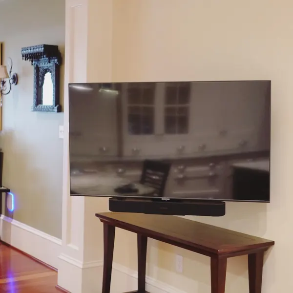 Wall-mounted TV with Sonos soundbar installation